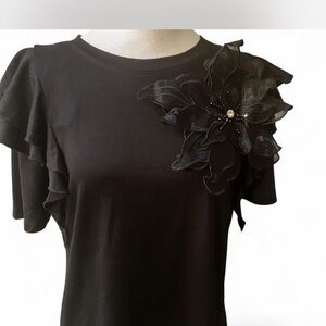 Badgley Mischka Black Ruffle Sleeve Top with Floral Accent. New Years  Edition